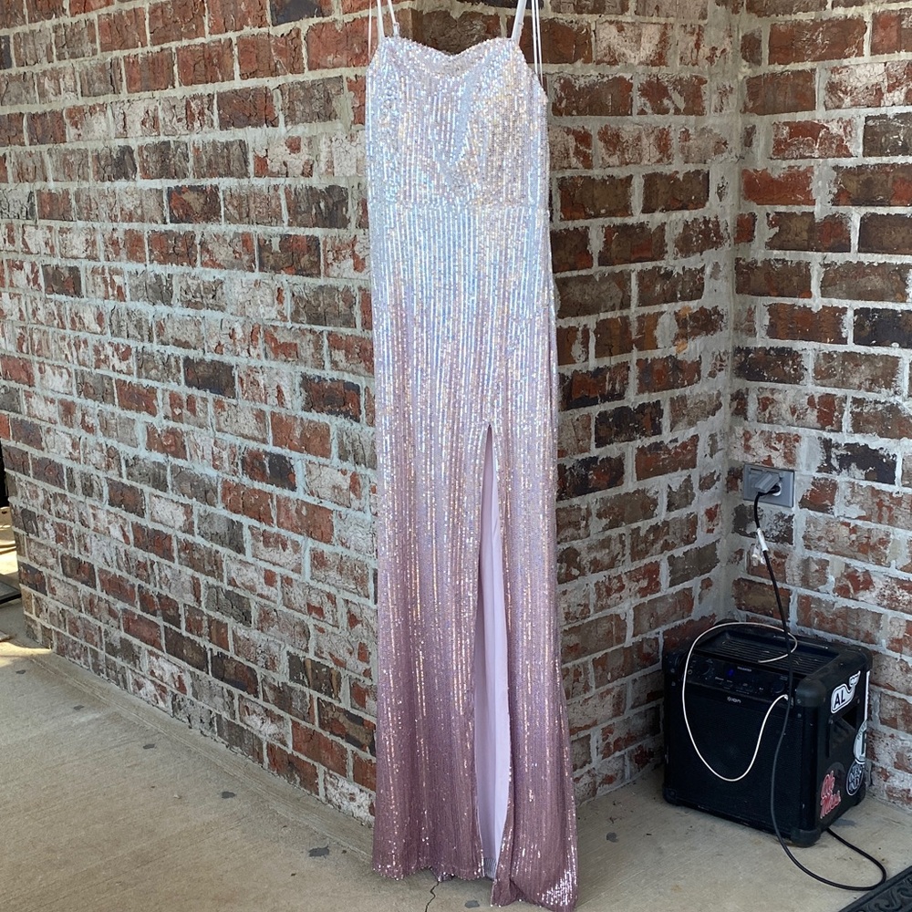 Full length silver fades to pink sequined dress with thin straps and high slit